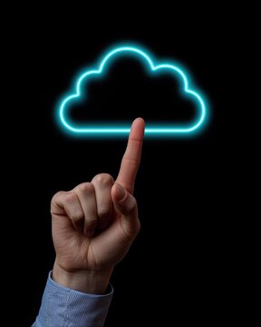 A hand points to a glowing cloud icon against a black background, symbolizing cloud computing and digital technology.