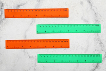 Set of plastic rulers on light background