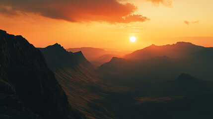 Fototapeta premium Mountain landscape at sunset with dramatic lighting and deep valleys in the background