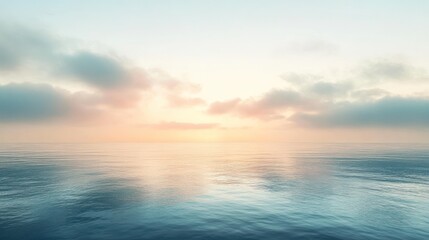 Obraz premium Serene ocean sunrise with calm water reflecting pastel sky and clouds.