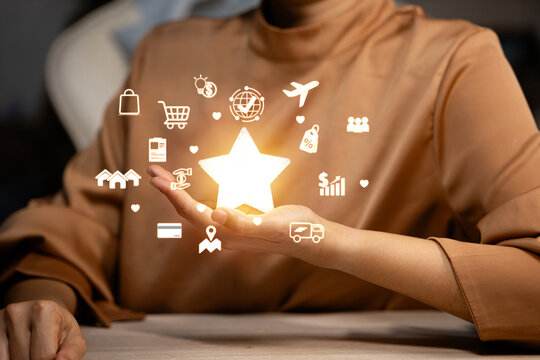 A hand presenting a glowing star surrounded by various icons, symbolizing excellence and a broad range of services.