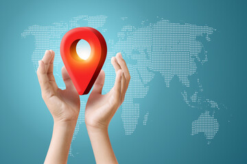 Hands holding a red map pin over a world map, representing location and navigation services.