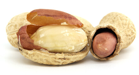 Close-Up of Whole and Shelled Peanuts on White Background