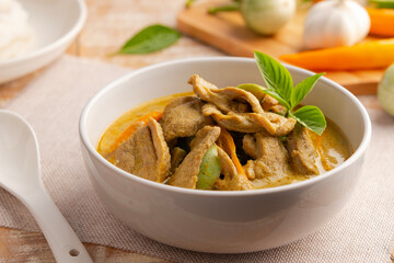Green Curry with duck meat.Thai sliced duck breast with green curry paste and coconut milk in white bowl ,thai food ,Gaeng Kiew Wan