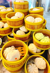 Dim sum set : steamed stuff bun, cream filling, chinese steamed pork, mixed vegetable filling, roasted red pork, minced pork with salted egg. All in bamboo basket steamer chiness style at restaurant, 