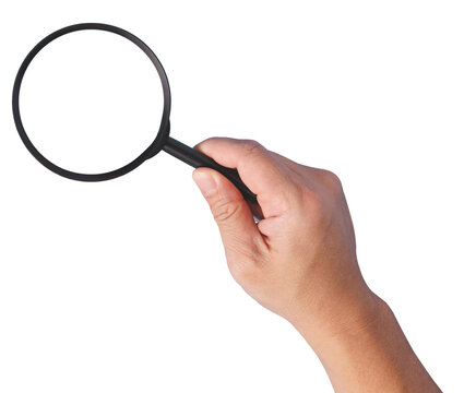A hand holding a magnifying glass with a transparent magnification lens glass isolated in white background.