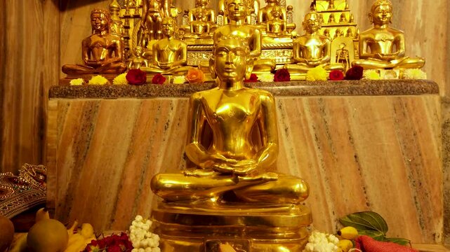 Mysuru, Karnataka, India-September 15 2024; A Divine view of Lord Mahavira and other deities sculptured in bronze metal at a Jain temple in India.
