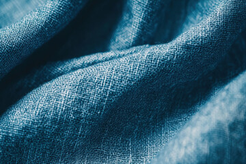 macro shot of grainy blue linen material, showcasing its texture and depth. fabric intricate weave creates visually appealing pattern, perfect for various design projects
