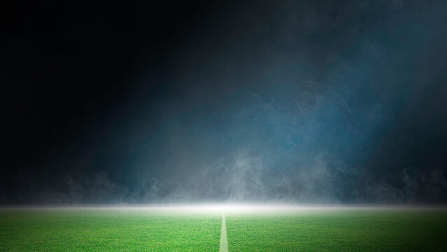 Green grass field sports stadium, Dark scene stage lights concert, spotlights and smoke floating up, night view for display soccer game of sport, competition, and entertainment