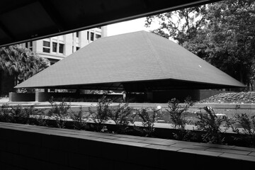 Semi-outdoor building with aesthetic red triangular roof
