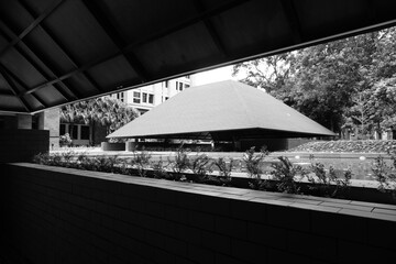 Semi-outdoor building with aesthetic red triangular roof
