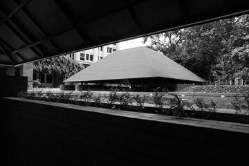 Semi-outdoor building with aesthetic red triangular roof