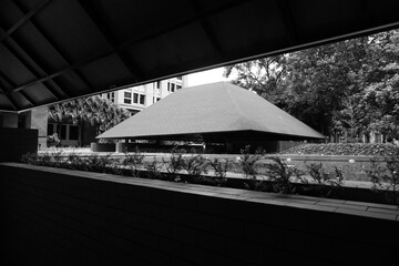 Semi-outdoor building with aesthetic red triangular roof