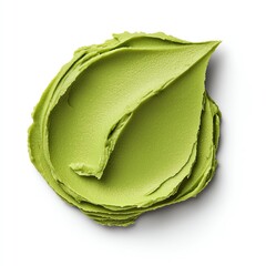 A smooth swirl of vibrant green cream, resembling a natural leaf, showcasing its rich texture and color.