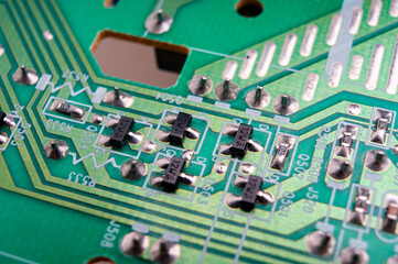electronic circuit board with the back side, on which the soldering and connecting tracks of radio...