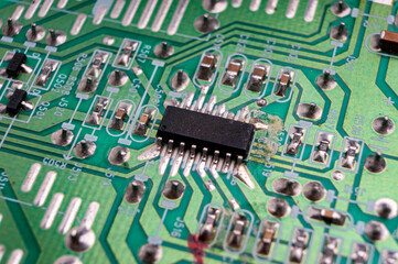 electronic circuit board with the back side, on which the soldering and connecting tracks of radio...