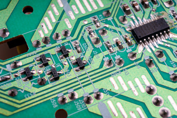 electronic circuit board with the back side, on which the soldering and connecting tracks of radio...