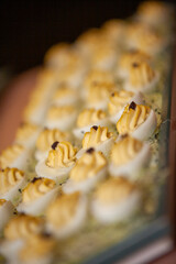 A stunning platter of beautifully garnished deviled eggs that are perfect as appetizers for any party gathering