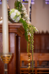 The floral decor greatly enhances the ambiance of a beautiful wedding celebration in a lovely church