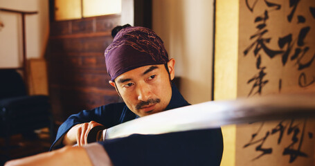 Dojo, form and sword with Samurai man in Japan for combat, martial arts or training, Culture, fight and weapon with face of Japanese person in kendogi for discipline, exercise or kenjutsu routine