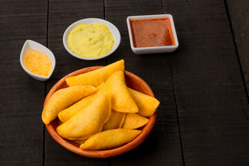Delicious traditional Colombian empanadas with spicy sauce