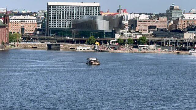 Stockholm Waterfront Congress Centre and the nearby buildings on a sunny day in Stockholm, Sweden
