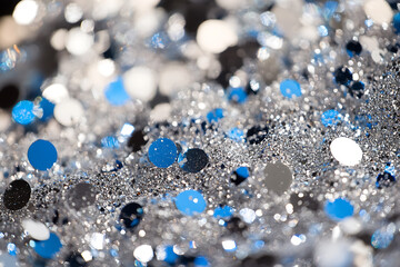 An elegant background with silver and blue sparkles, perfect for sophisticated New Year designs, party themes, and winter celebrations