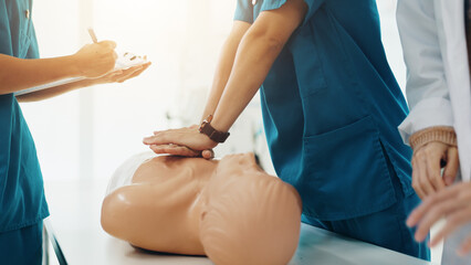 Hands, medical school and cpr for emergency, education or practical training in hospital as...