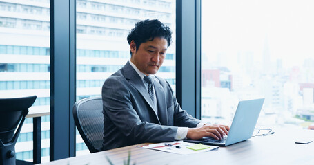 Japan, business and man in office, laptop and typing with economy analyst, internet and network....