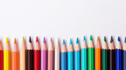 Colorful collection of wooden colored pencils arranged in a row on a white background showcasing vibrant hues and artistic potential.