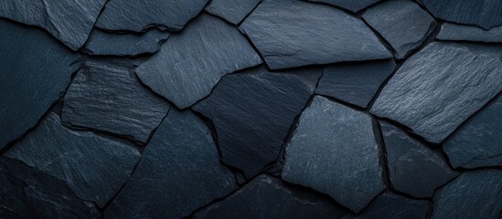 Textured dark slate roofing surface showcasing proper installation techniques and material specifications for durable construction.