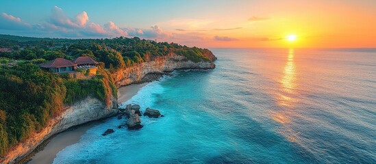 Obraz premium Uluwatu coastline sunset view showcasing surfing waves and scenic cliffs captured from a drone perspective