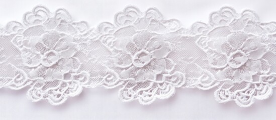 Delicate lace trim featuring floral patterns on a white wedding dress highlighting elegance and craftsmanship in bridal fashion.