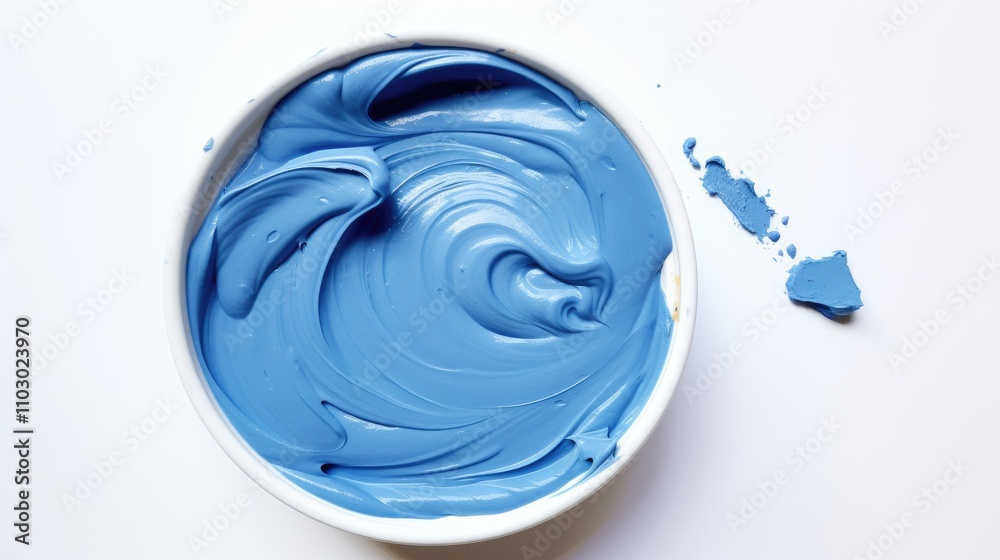 Aufkleber Blue foamy modeling paste in a white bowl on a clean surface showcasing its smooth, creamy texture for creative projects and crafts.