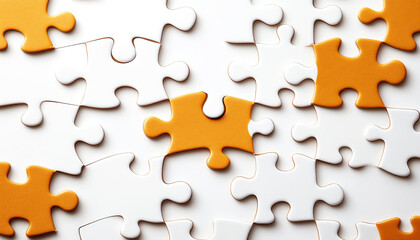 Colorful jigsaw puzzle pieces scattered on surface background, showcasing creativity and fun.