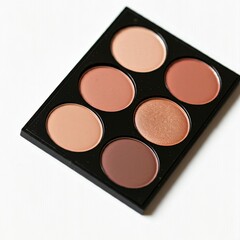 closeup of a compact makeup palette with six different neutral tones  on a white background  for beauty makeup concept