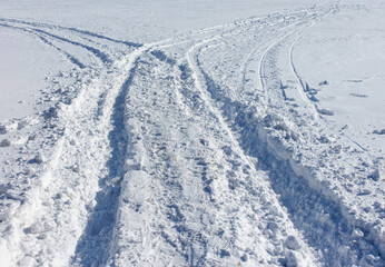 The snow is deep and the tracks are visible