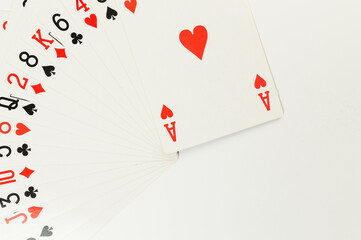 Top view of playing cards on white background. Board game, poker. Copy space, flat lay.