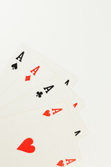 Top view of playing cards on white background. Four aces cards, board game, poker. Copy space, flat lay.