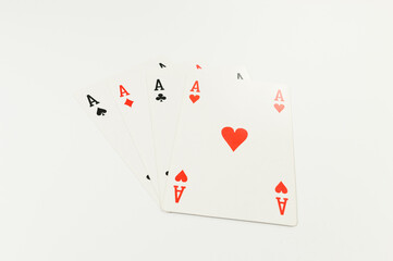 Fototapeta na wymiar Top view of playing cards on white background. Four aces cards, board game, poker. Copy space, flat lay.