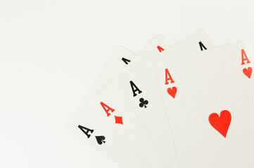 Top view of playing cards on white background. Four aces cards, board game, poker. Copy space, flat lay.