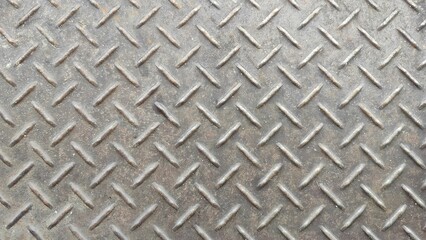 Metal or sheet metal background, steel plate surface texture. A close-up of a metallic, diamond...