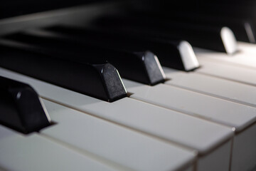 Jazz Piano Keys. Close-up of piano keys, focused on one note, with foreground and background fading...