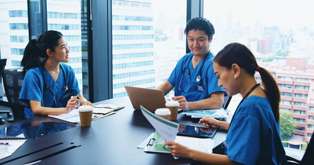 Asian people, nurse or team with documents in meeting for medical discussion, planning or budget at...