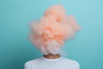 Person wearing white shirt covered by an orange cloud on turquoise background