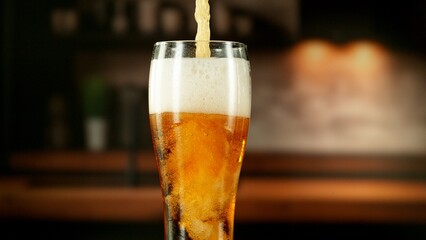 Close-up of beer pouring into pint , freeze motion.