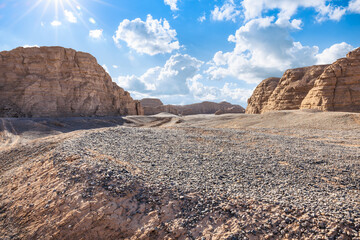 Gravel road platform and Yardang landform mountain natural landscape in Xinjiang, China. Outdoor natural background.