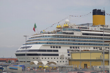 Modern Italian cruiseship cruise ship liner Fascinosa during sunset in port of Savona, Italy during...