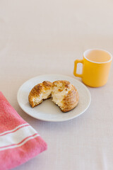 choux cream or cream puff or French profiteroles with fresh cream set on cafe table with antique colored cup