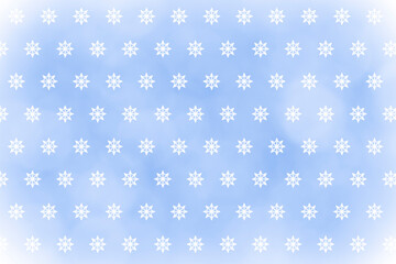 white snowflakes against light blue bokeh backdrop